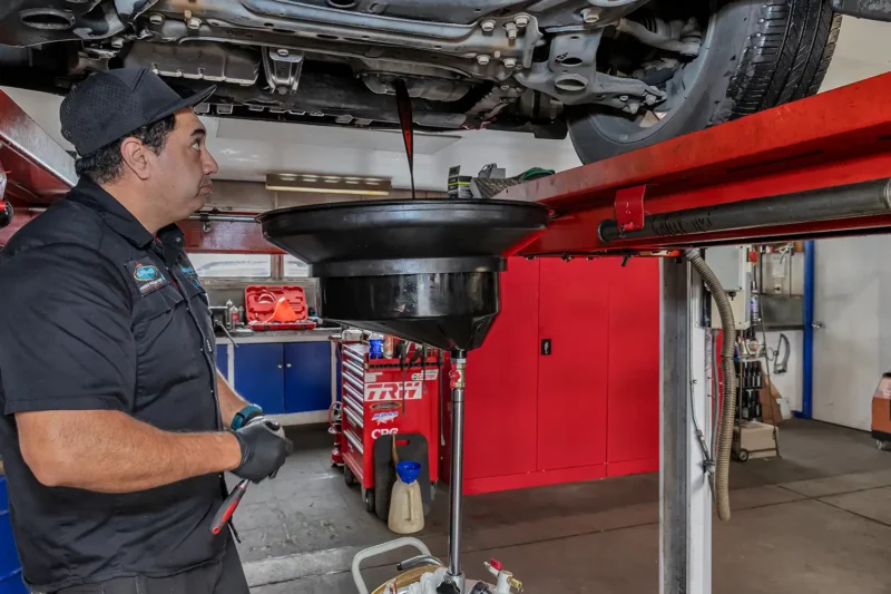 Man servicing vehicle